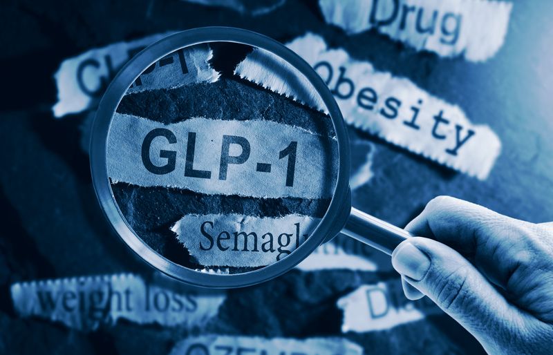 Magnifying glass highlighting GLP-1 and semaglutide text